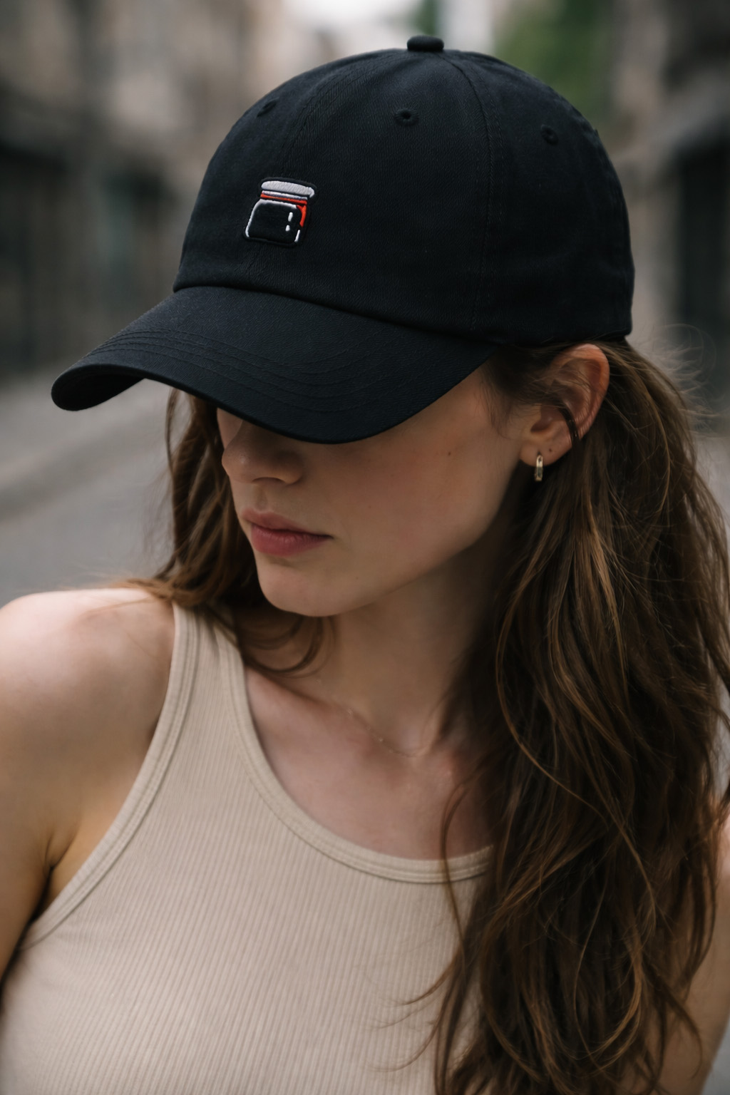 Swearjam six-panel cap in washed black with embroidered jam-jar mark above the brim